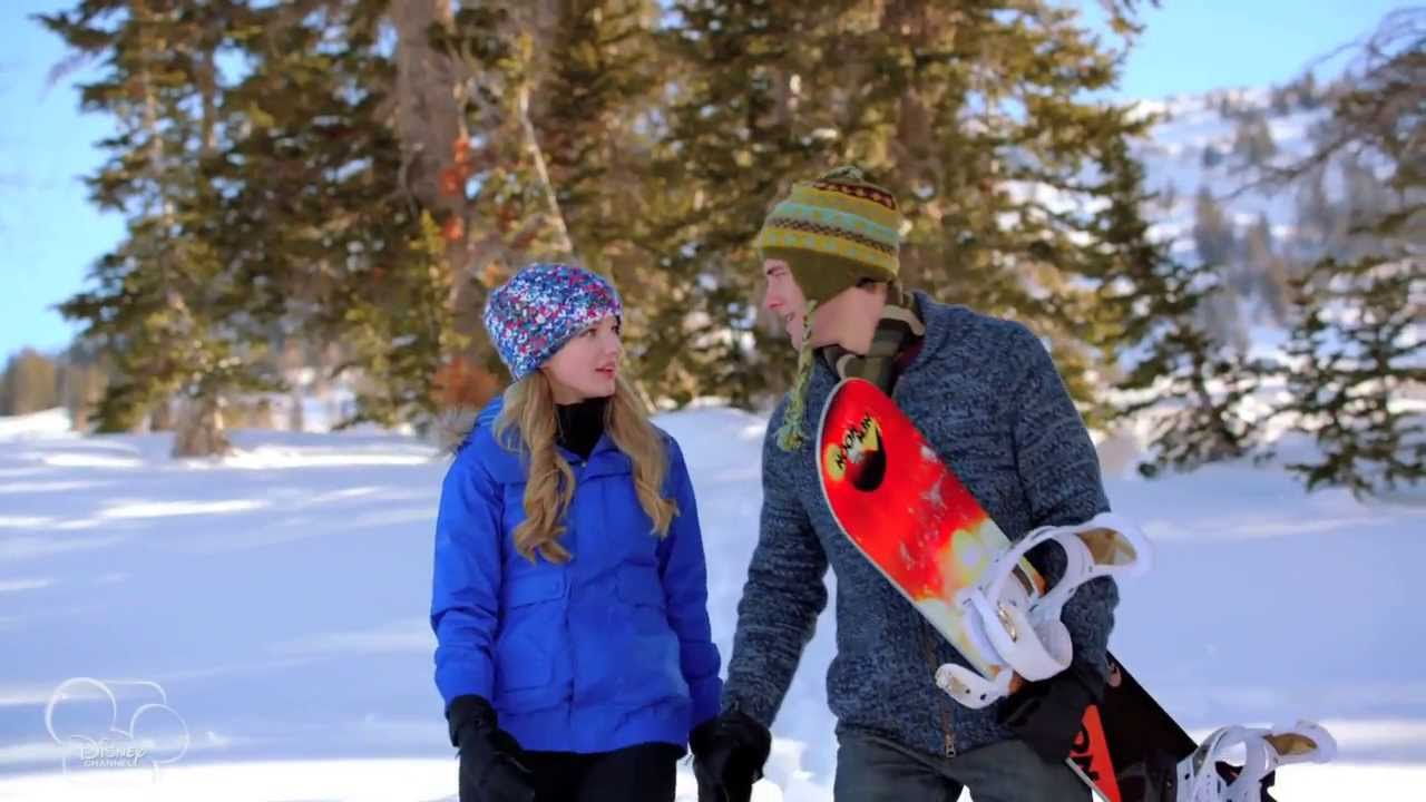 Dove Cameron and Luke Benward outdoors in snow talking